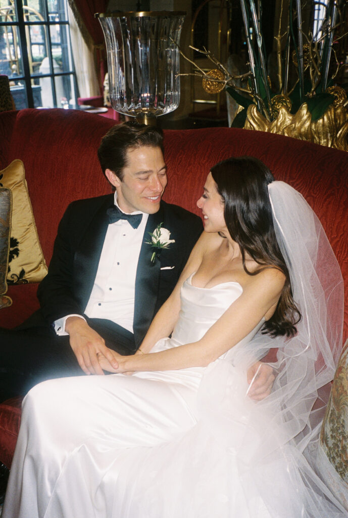 A wedding couple laughs at the St. Regis Hotel in Washington, DC