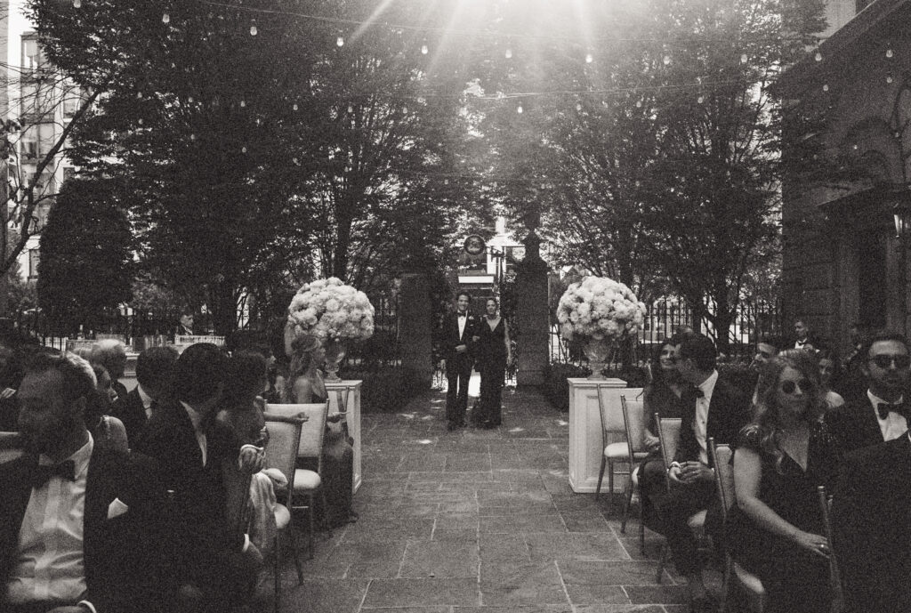 A groom walks down the aisle at the St. Regis Hotel in Washington, DC