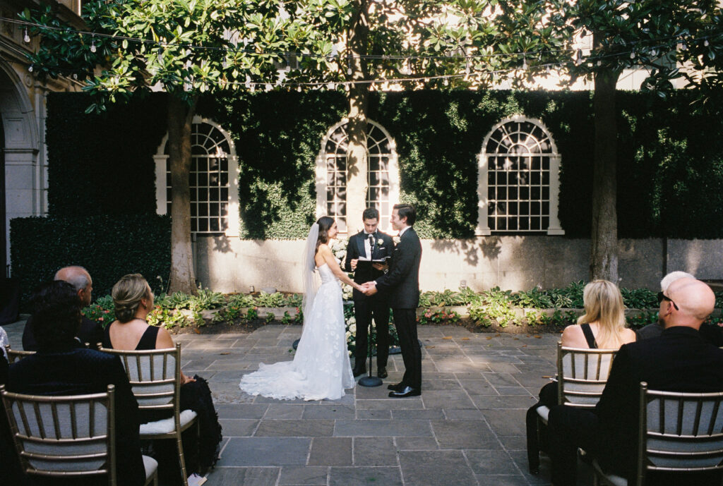 A couple gets married at the St. Regis Hotel in Washington, DC