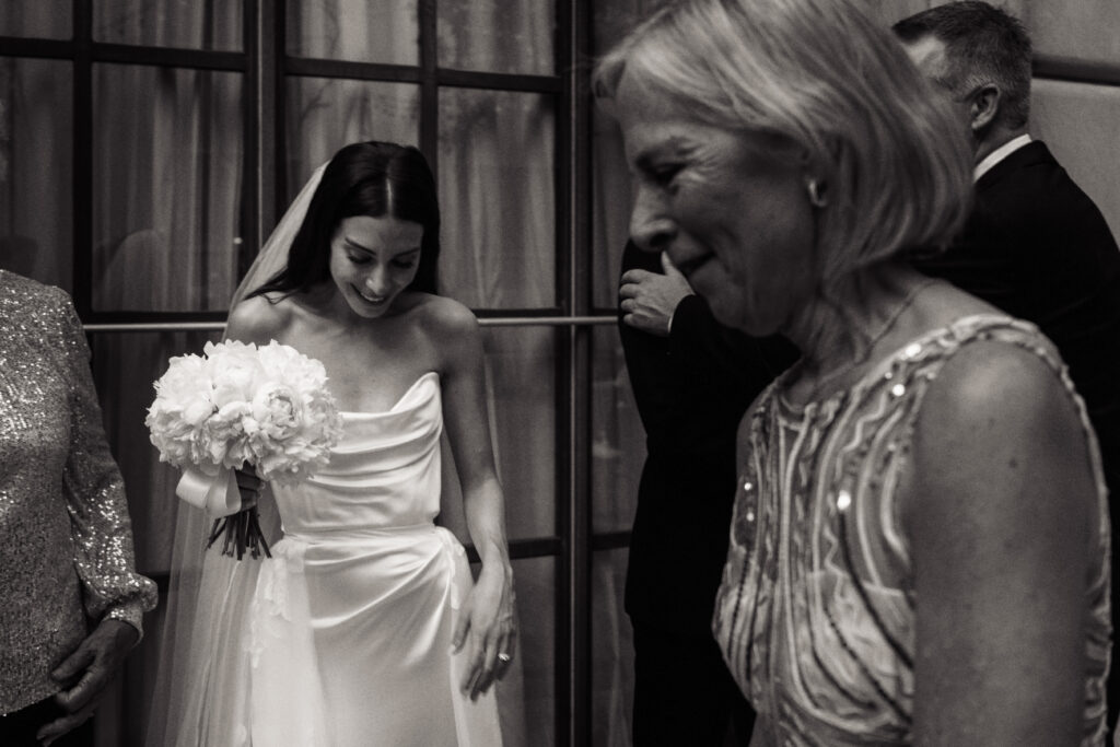 A bride smiles at the St. Regis Hotel in Washington, DC