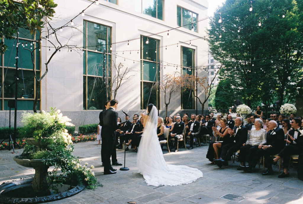 A wedding couple gets married at the St. Regis Hotel in Washington, DC