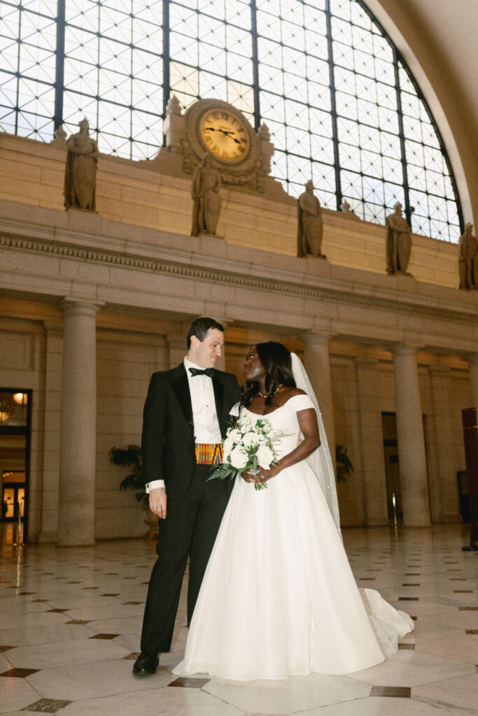 A Union Station wedding couple poses for pictures in Washington DC