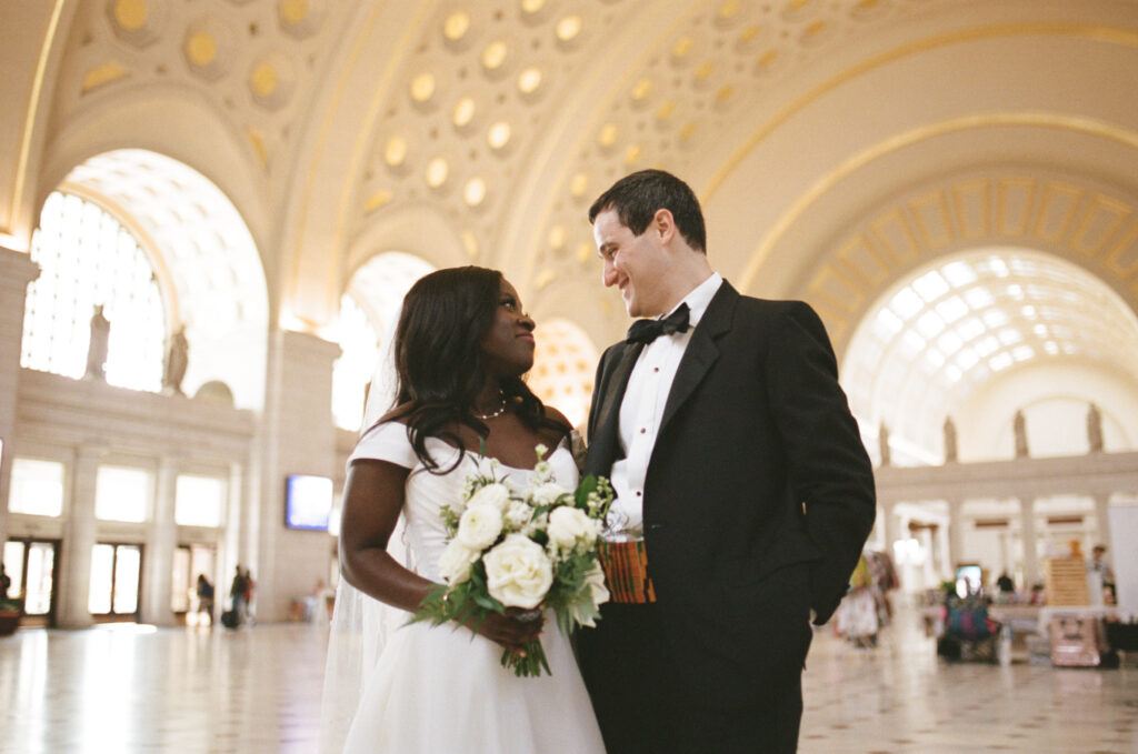 A Union Station wedding couple poses for pictures in Washington DC