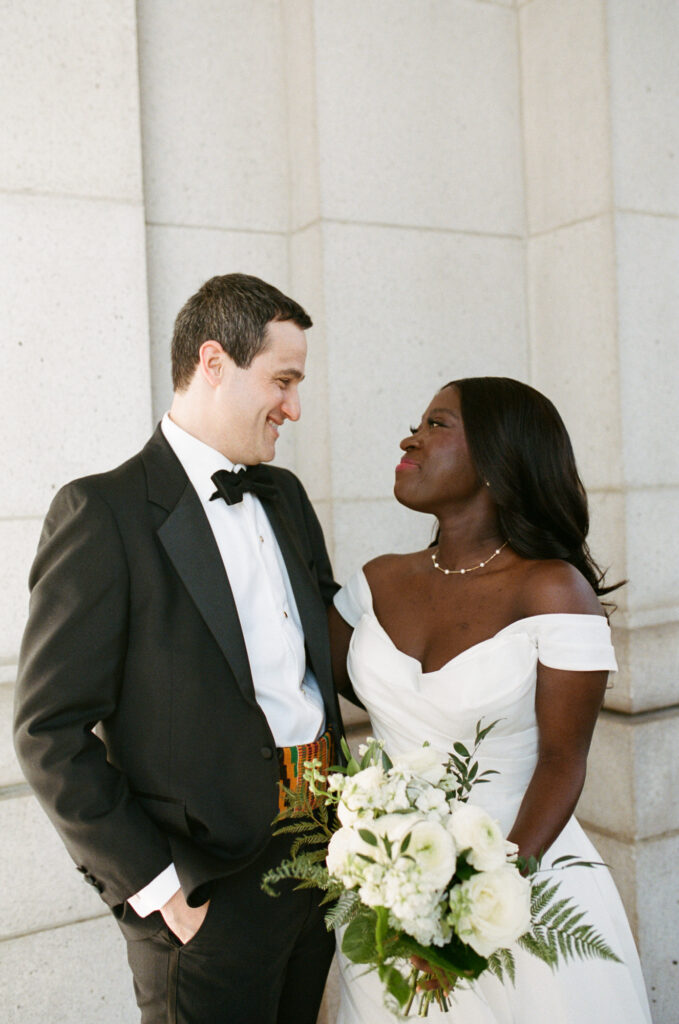 A Union Station wedding couple look at one another in front of their ceremony in Washington DC