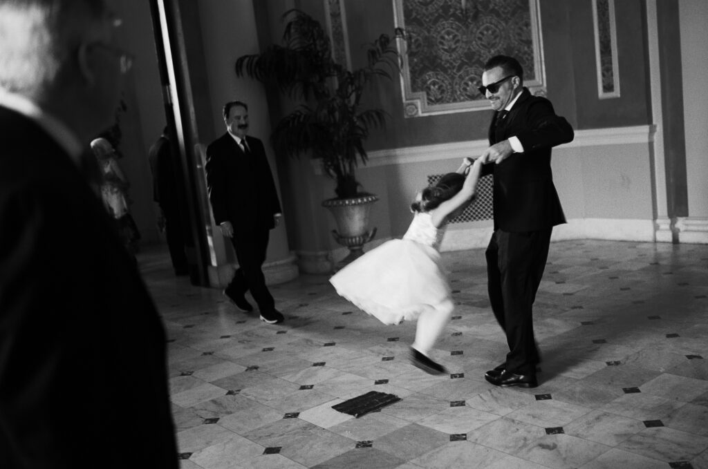 A child plays with their dad during a wedding ceremony at Union Station in Washington DC