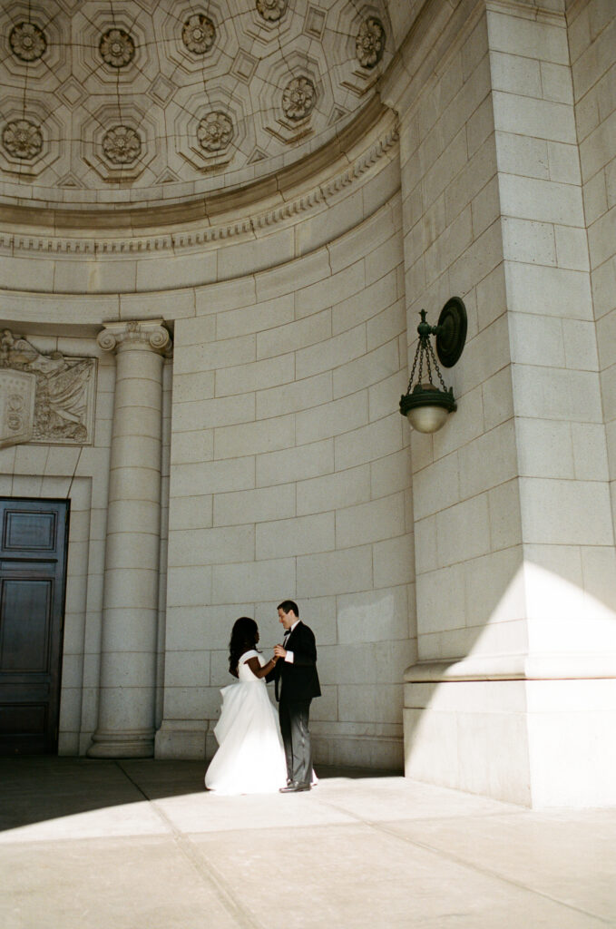 A Union Station wedding couple dances in front of their ceremony in Washington DC